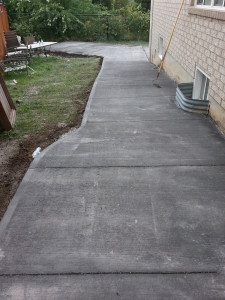 Completed installation of new Boulder colour concrete driveway