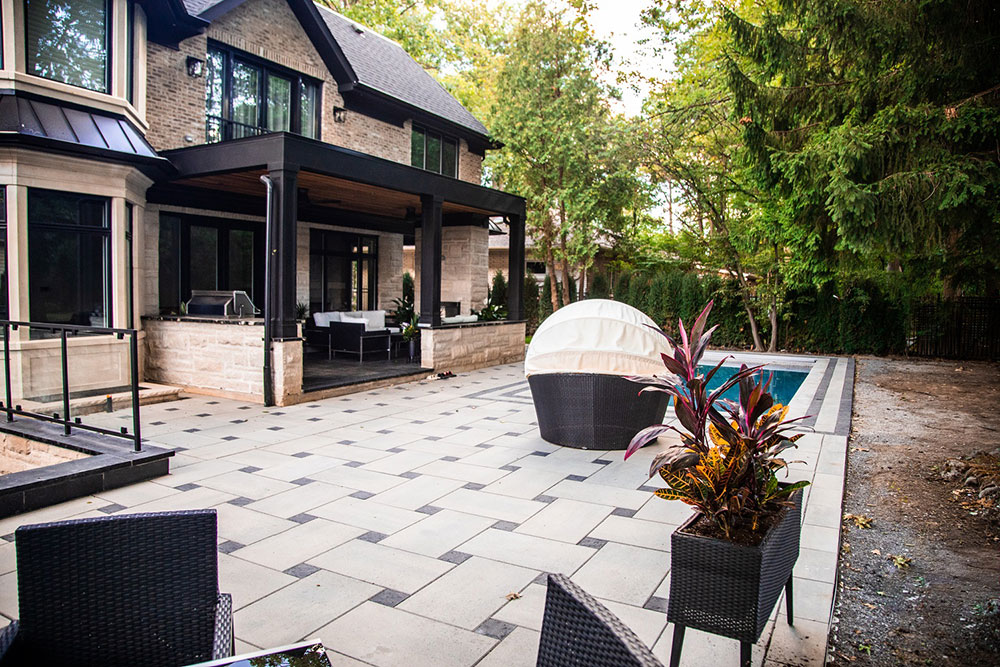Landscaping the Whole House with Both Interlocking Pavers and Exposed Aggregate Concrete